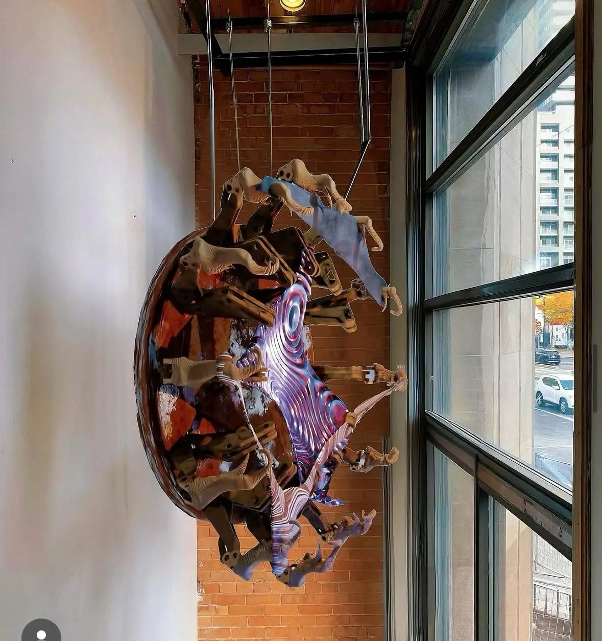 Knitting Echoes suspended beside the gallery window