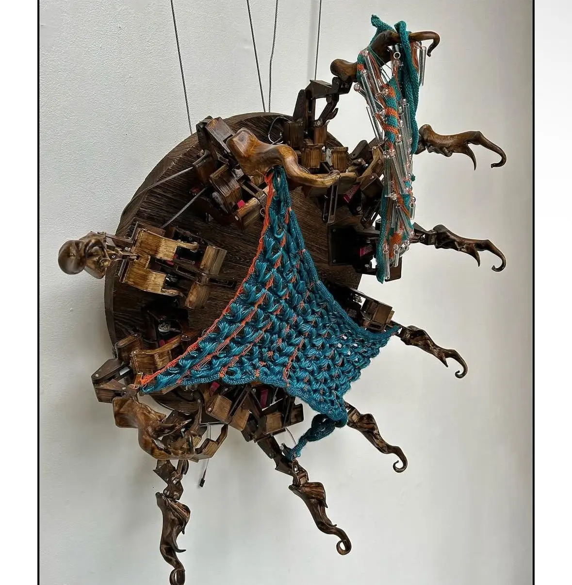 The sculpture seen from below, knitted membrane stretched between arms
