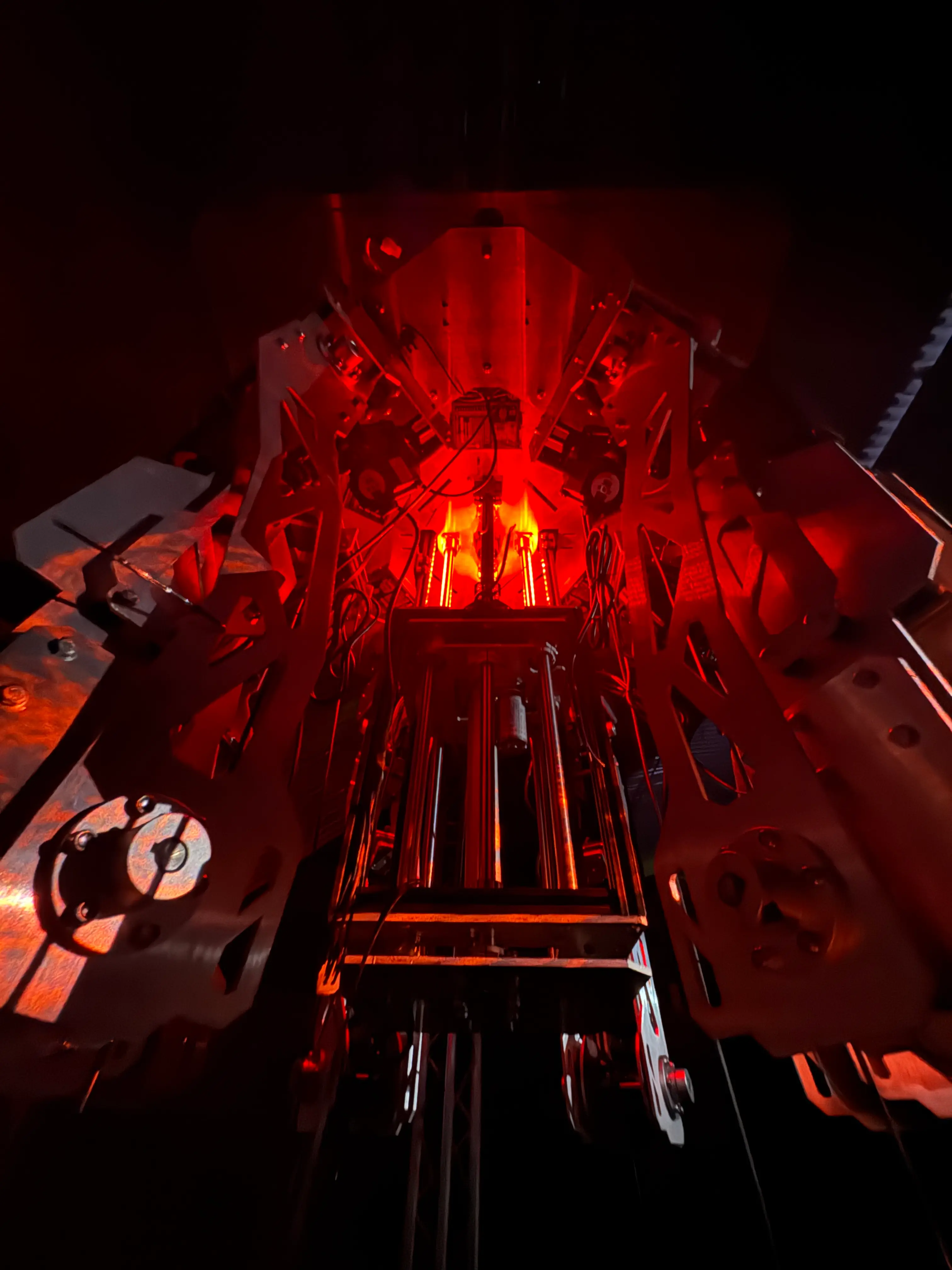 Looking up into the machine core — symmetric armatures around the glowing centre