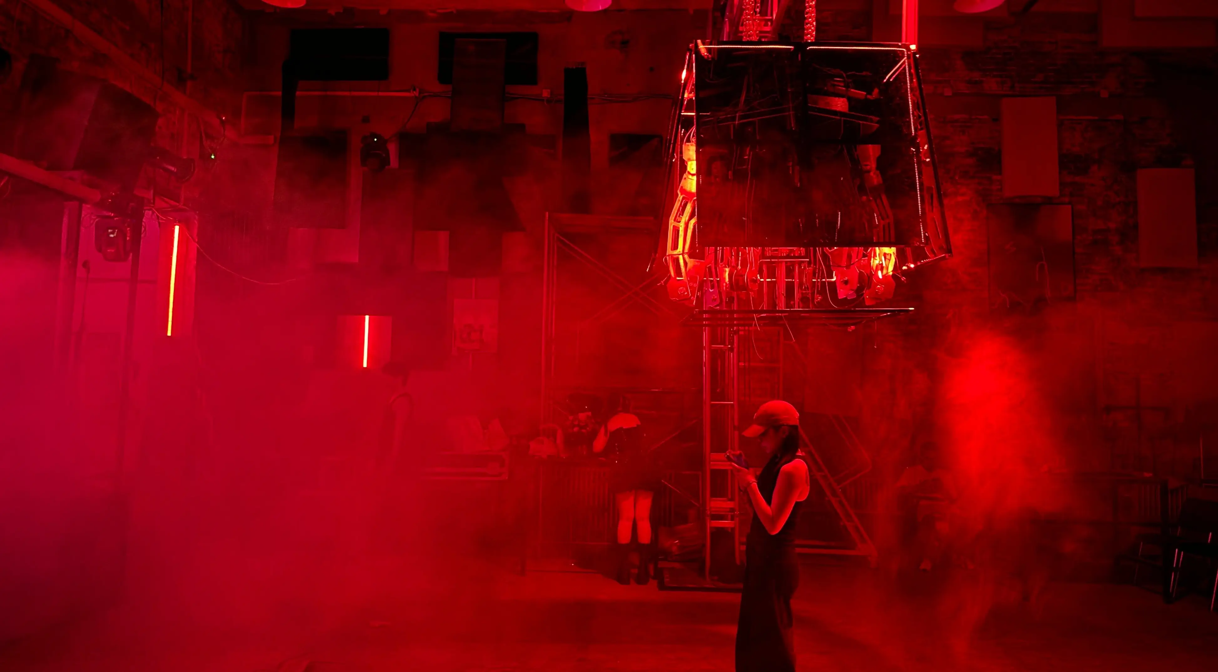 Blackbox — suspended kinetic installation by DFFF Studio, red-lit hall
